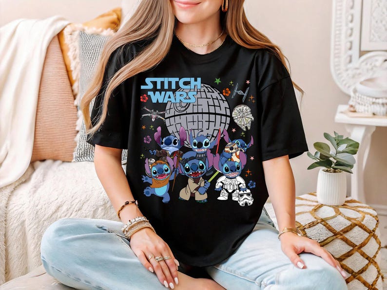 a woman sitting on a bed wearing a black stitch wars t - shirt