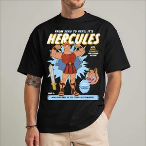 a man wearing a black shirt with a cartoon character on it