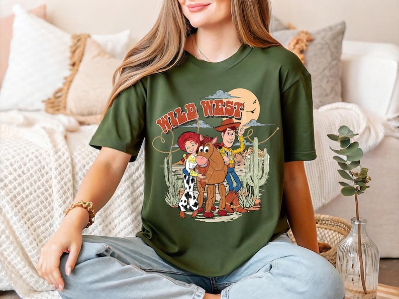 a woman sitting on the floor wearing a green t - shirt