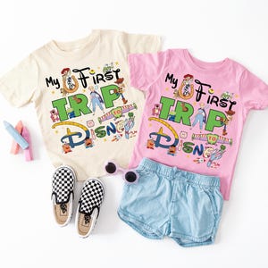 a couple of shirts and shorts on a white surface