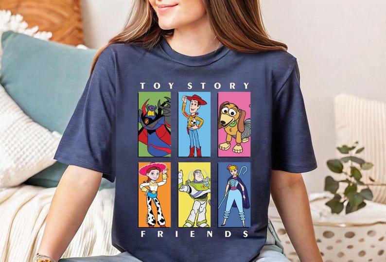 a woman sitting on a couch wearing a t - shirt that says tot story