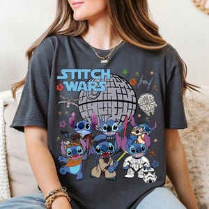 a woman sitting on a couch wearing a t - shirt with stitch wars on it