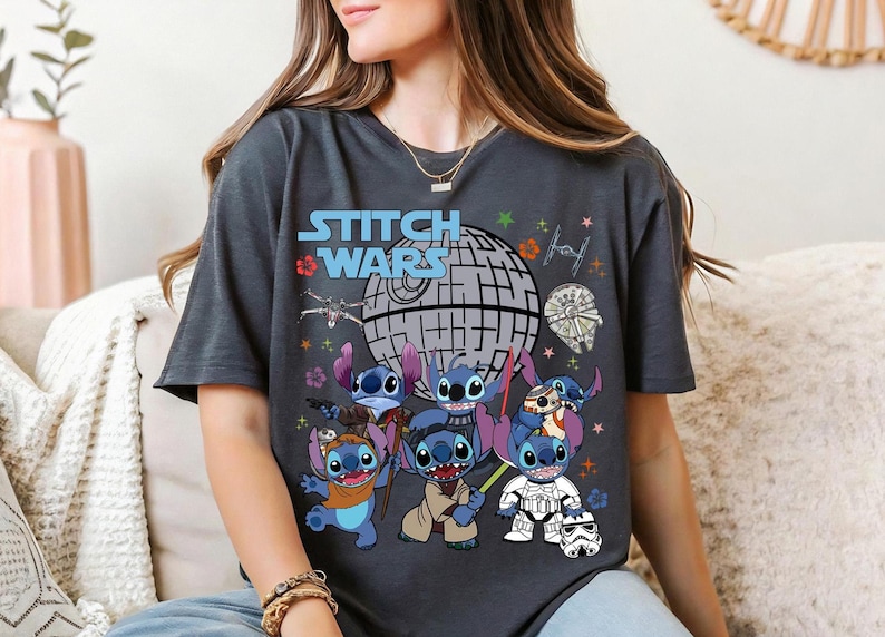 a woman sitting on a couch wearing a t - shirt with stitch wars on it