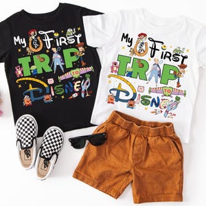 two children's clothing items are laid out on a white surface