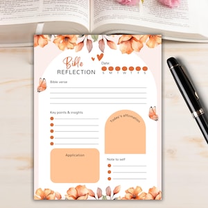 May include: A Bible reflection journal with a floral design, featuring the words "Bible Reflection". It includes sections for Bible verses, key points, and affirmations. The design incorporates orange flowers, butterflies, and a weekly calendar.