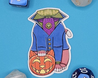 May include: A sticker featuring a cartoon cat dressed in a blue coat and holding an orange jack-o'-lantern. Surrounding the sticker are four dice: a blue six-sided die, a clear glittery twenty-sided die, a clear glittery eight-sided die, and a blue ten-sided die.