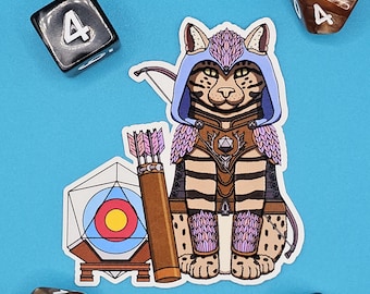 May include: A sticker featuring a cat dressed as a fantasy archer, with a bow and arrow, quiver, and target. The cat is wearing a blue hood and armor. Four dice surround the sticker on a blue background.