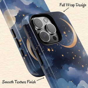 May include: A phone case with a night sky design featuring a crescent moon, stars, and clouds in shades of blue and gold. The case has a smooth texture finish and a full wrap design. The camera lenses are visible.