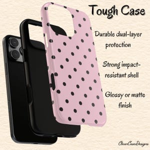 May include: A pink phone case with black polka dots, featuring the text "Tough Case." The case is shown in layers, highlighting its dual-layer protection and impact-resistant shell. The design includes a glossy or matte finish.