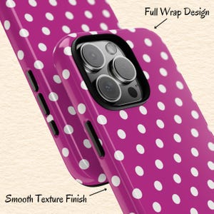 May include: A magenta phone case with a white polka dot pattern. The case has a black camera frame and the text "Full Wrap Design" and "Smooth Texture Finish".