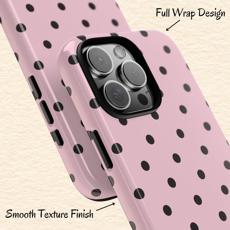 May include: Pink phone case with black polka dots. The case has a smooth texture finish and a full wrap design. The case has a black border around the camera lenses.