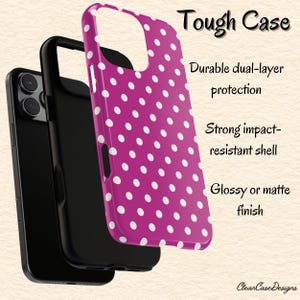May include: A magenta phone case with white polka dots, showcasing its dual-layer construction. The image highlights the case's impact-resistant shell and glossy or matte finish. Text reads "Tough Case" and "Clean Case Designs."