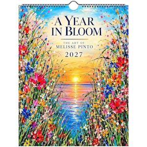 May include: A 2027 wall calendar titled A Year in Bloom, The Art of Melisse Pinto. The cover features a vibrant, impressionistic painting of a sunset over water, framed by colorful wildflowers in shades of red, blue, yellow, and green.