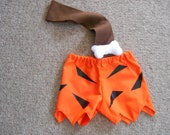 Bam Bam Costume option of club size 0-3 months through size 6 includes shorts, bone and strap option of club