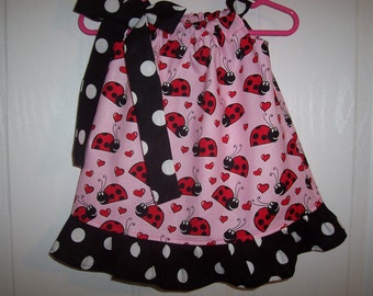 Ladybug girls pink pillowcase dress with black with white dot tie and ruffle infant through 7/8 years