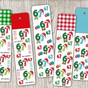 May include: Five Christmas bookmarks with a festive design. Each bookmark displays the number 67 with elf-like figures, Santa hats, and baubles. The words "six seven" are repeated on each bookmark.