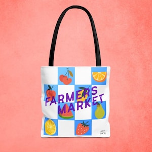 May include: White tote bag with a black handle featuring a checkered pattern with fruit illustrations and the text "FARMERS MARKET" in purple. Includes images of cherries, an orange slice, a watermelon slice, a pear, a lemon slice, and a strawberry.