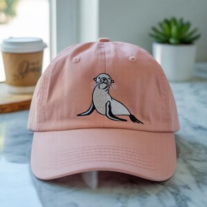 The Curious Little Seal Watching the Ocean World Embroidered Hat