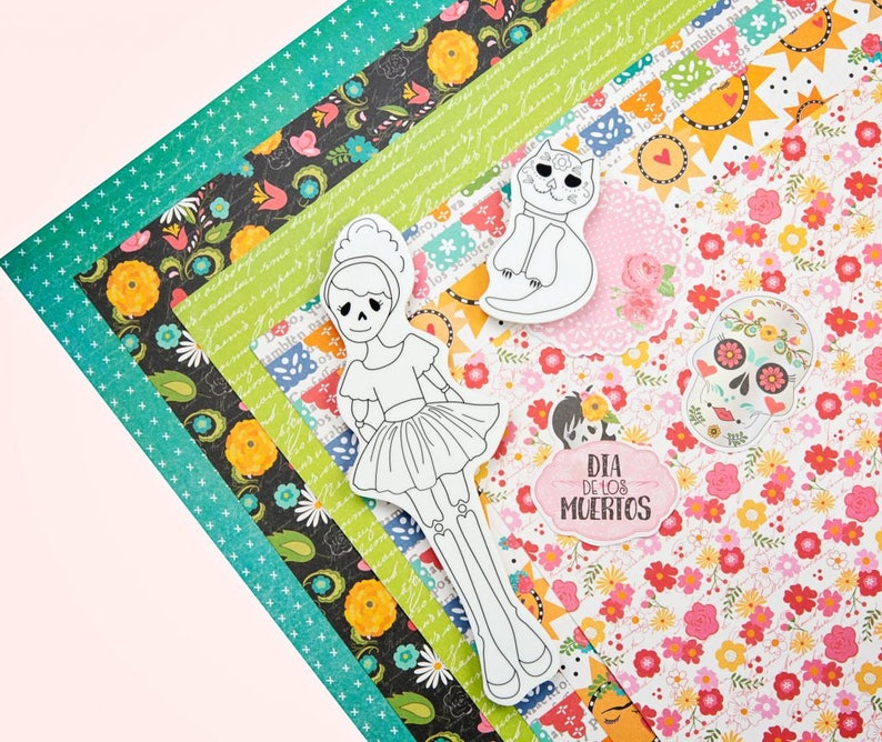 Pode incluir: Um conjunto de pap&eacute;is com padr&otilde;es coloridos com imagens recortadas de um esqueleto, um gato e uma caveira. Os pap&eacute;is s&atilde;o decorados com flores, estrelas e o texto "Dia de los Muertos".