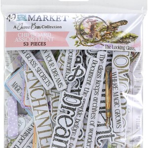 May include: A clear plastic package containing a chipboard assortment with 53 pieces. The package features text that reads "49 and MARKET" and "The Looking Glass." The chipboard pieces have various words and phrases.