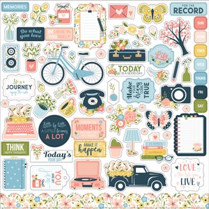 Puede incluir: Una hoja de pegatinas coloridas con una variedad de diseños, incluyendo flores, mariposas, una bicicleta, un tocadiscos vintage, un camión, una cámara, un teléfono, una lámpara, una máquina de escribir y un cuaderno. Las pegatinas presentan citas y frases inspiradoras, como "Haz lo que amas", "Cree en ti mismo", "La vida es un viaje", "Haz que tus sueños se hagan realidad", "Vive por los momentos", "Hoy es tu día", y "Ama la vida que vives".