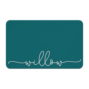 May include: Teal blue rectangular sign with the word "willow" written in white cursive script.