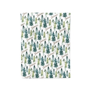 May include: A white background with a repeating pattern of watercolor green and blue trees. The name "Jackson" is written in brown cursive throughout the pattern.