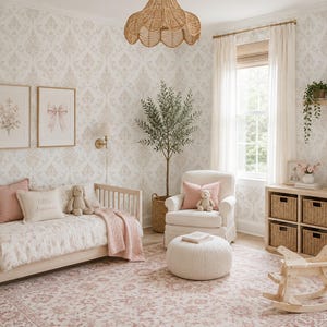 May include: A nursery room featuring a light wood daybed with pink bedding, a cream armchair with a matching ottoman, a wooden rocking horse, and a storage unit with woven baskets. The walls have a light damask pattern and two framed prints.