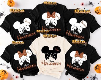 May include: Black and cream-colored Halloween t-shirts with a Mickey Mouse silhouette design. Each shirt features the word "Halloween" and family member names like "Mommy", "Daddy", "Sister", "Brother", "Son", and "Lina".