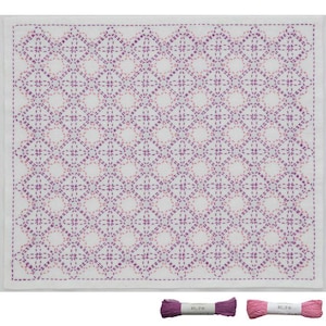 May include: White square fabric with a repeating geometric pattern in shades of purple, created with visible stitching. Two spools of thread, one purple and one pink, are at the bottom.