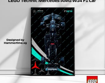May include: A black and white wall-mounted frame featuring a LEGO Technic Mercedes-AMG W14 F1 Car. The car is black with green and white accents. The frame has the text "F1W14" and "PETRONAS" on it. The frame is designed by Hammertime.sg. The LEGO logo and the number 42171 are visible in the bottom right corner.