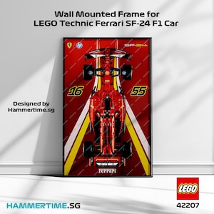 May include: A wall mounted frame featuring a red LEGO Technic Ferrari SF-24 F1 car with the numbers 16 and 55 on the side. The frame has a black border and the text "LEGO 42207" is visible in the bottom right corner.