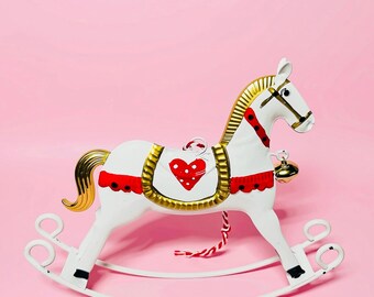 Vintage style Christmas rocking horse decoration. Traditional tin rocking horse ornament or large tree decoration.