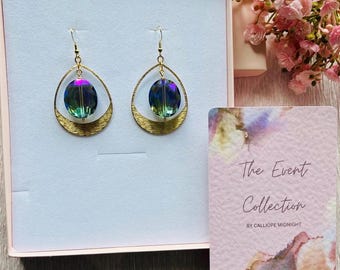 Oversize blue earrings. Iridescent handmade earrings by Calliope Midnight. Event Collection 2026.