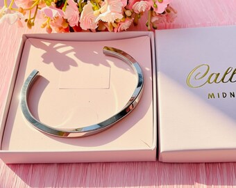 Minimalist stainless steel open cuff bangle bracelet. Chunky light twist. Boxed.