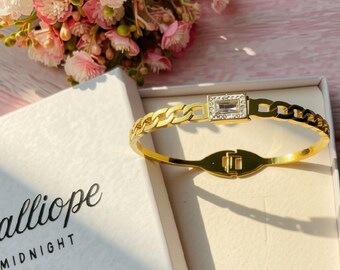 Stone hinged bangle. Golden bangle with rose stone and faux diamond setting.
