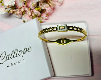 Stone hinged bangle. Golden bangle with rose stone and faux diamond setting.