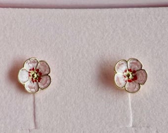 Enamel floral stud earrings. Whimsical pearlescent pink with red detailing.