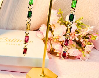 Long multicoloured earrings. Jewel tone stones dangle drops.