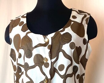 1960’s  white and brown abstract print crepey poly sleeveless drop waist dress with pleated skirt