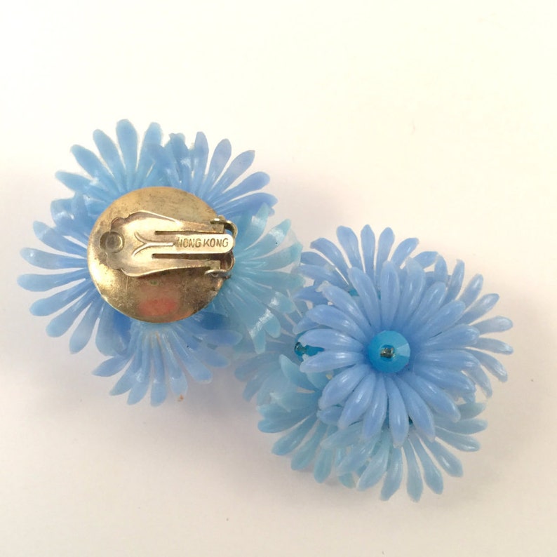 1950s light blue soft plastic flower earrings image 3