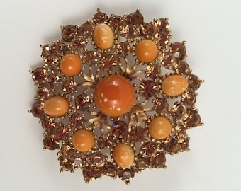 1960s Weiss orange plastic and amber rhinestone brooch