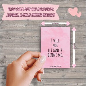 Puede incluir: Una tarjeta rosa con el texto "I WILL NOT LET CANCER DEFINE ME" y "STRENGTH & SURVIVAL". La tarjeta mide aproximadamente 6 cm x 9 cm.