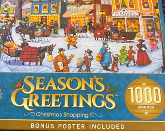 Könnte beinhalten: Ein 1000-teiliges Puzzle mit dem Titel "Season's Greetings: Christmas Shopping". Die Box zeigt eine winterliche Weihnachtsszene mit Pferdekutschen, Geschäften und Menschen. Ein Bonus-Poster ist enthalten.