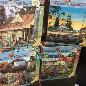 NIP Masterpiece 750 piece “Welcome to Eagle Bay“ big picture puzzle - William S. Kreutz artist