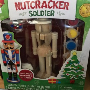 May include: A wooden nutcracker soldier craft kit with paint and fur. The kit includes 5 acrylic paints (0.84 fl oz (25 ml)) and 1 metallic finish (0.16 fl oz (5 ml)).