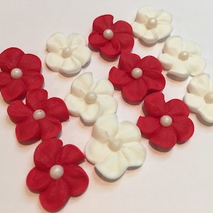 150 royal icing flowers (75 white, 75 red) Approx. size 1/2” with sugar pearl center