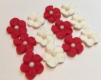 150 royal icing flowers (75 white, 75 red) Approx. size 1/2” with sugar pearl center