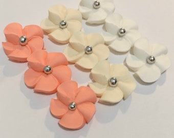 100 royal icing sugar flowers ( 34 white, 34 ivory, 34 peach) Approx. size 3/4” with silver sugar center