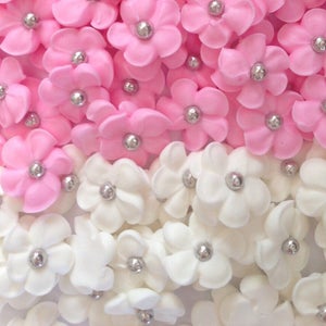 100 royal icing flowers ( 50 white, 50 pink) Approx.size 1/2” with silver sugar center